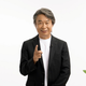 Shigeru Miyamoto gestures toward the screen while surrounded by Pikmin during today's Nintendo Direct.